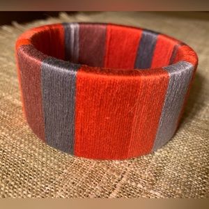 Multicolored cuff bracelet in reds and grays